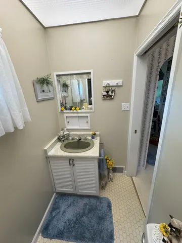 a room with a sink and cabinets