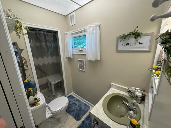 a bathroom with a toilet and a sink