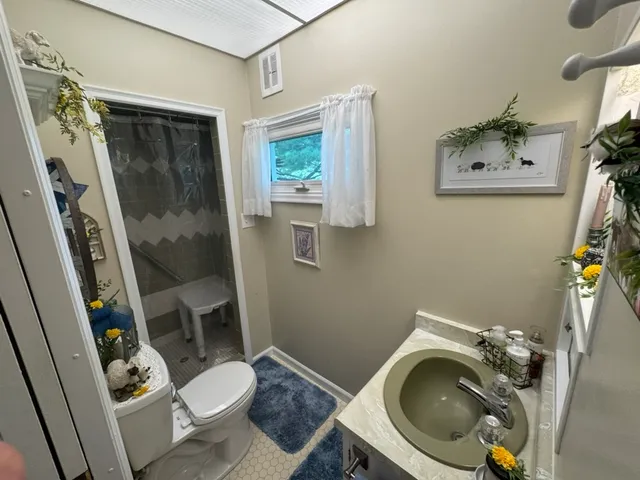 a bathroom with a toilet and a sink