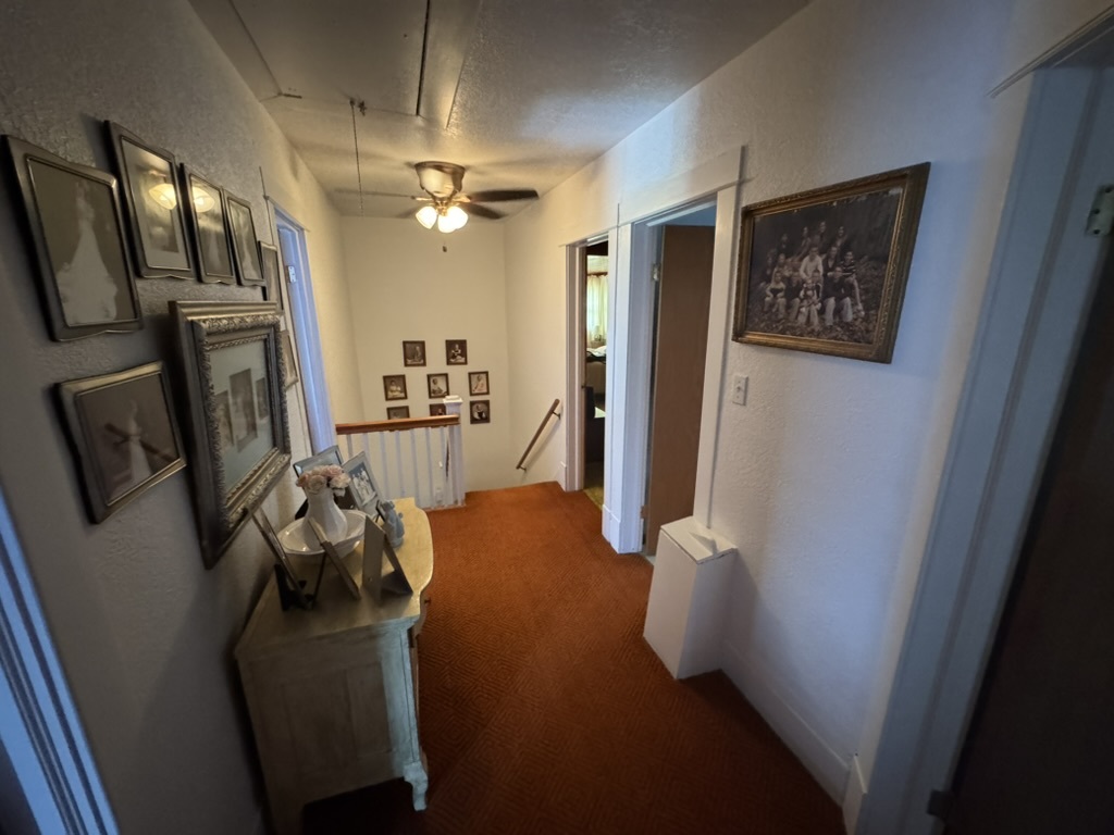 401 West 10th Street Sterling, IL 61081 - Photo 22 of 35 a view of a hallway with furniture and a livingroom