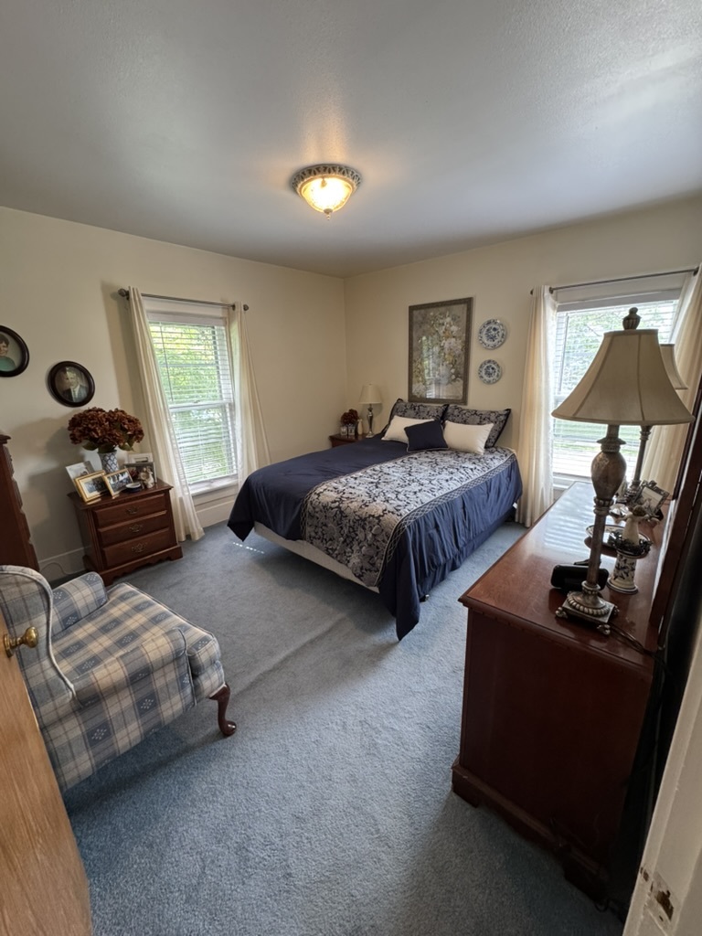 401 West 10th Street Sterling, IL 61081 - Photo 27 of 35 a bedroom with two beds and painted walls