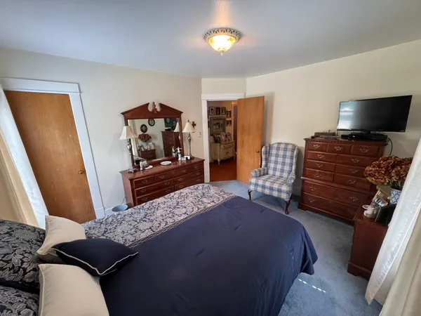 a bedroom with a bed and furniture