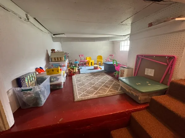 a living room with furniture and a table