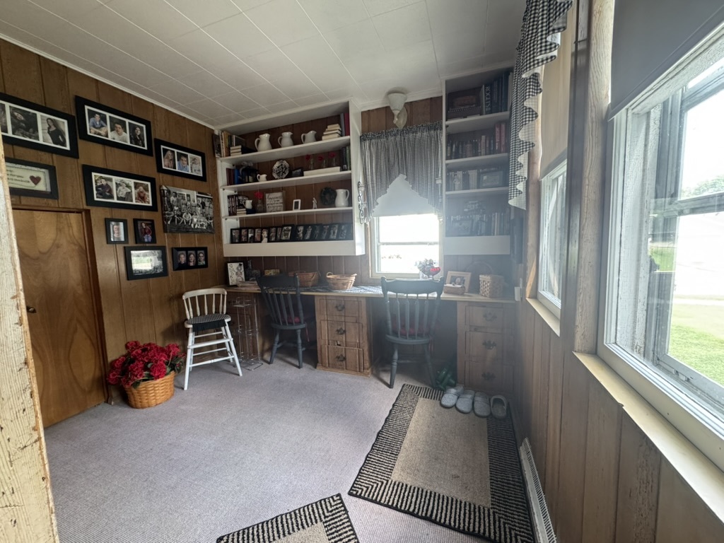 401 West 10th Street Sterling, IL 61081 - Photo 9 of 35 a room with furniture and a book shelf