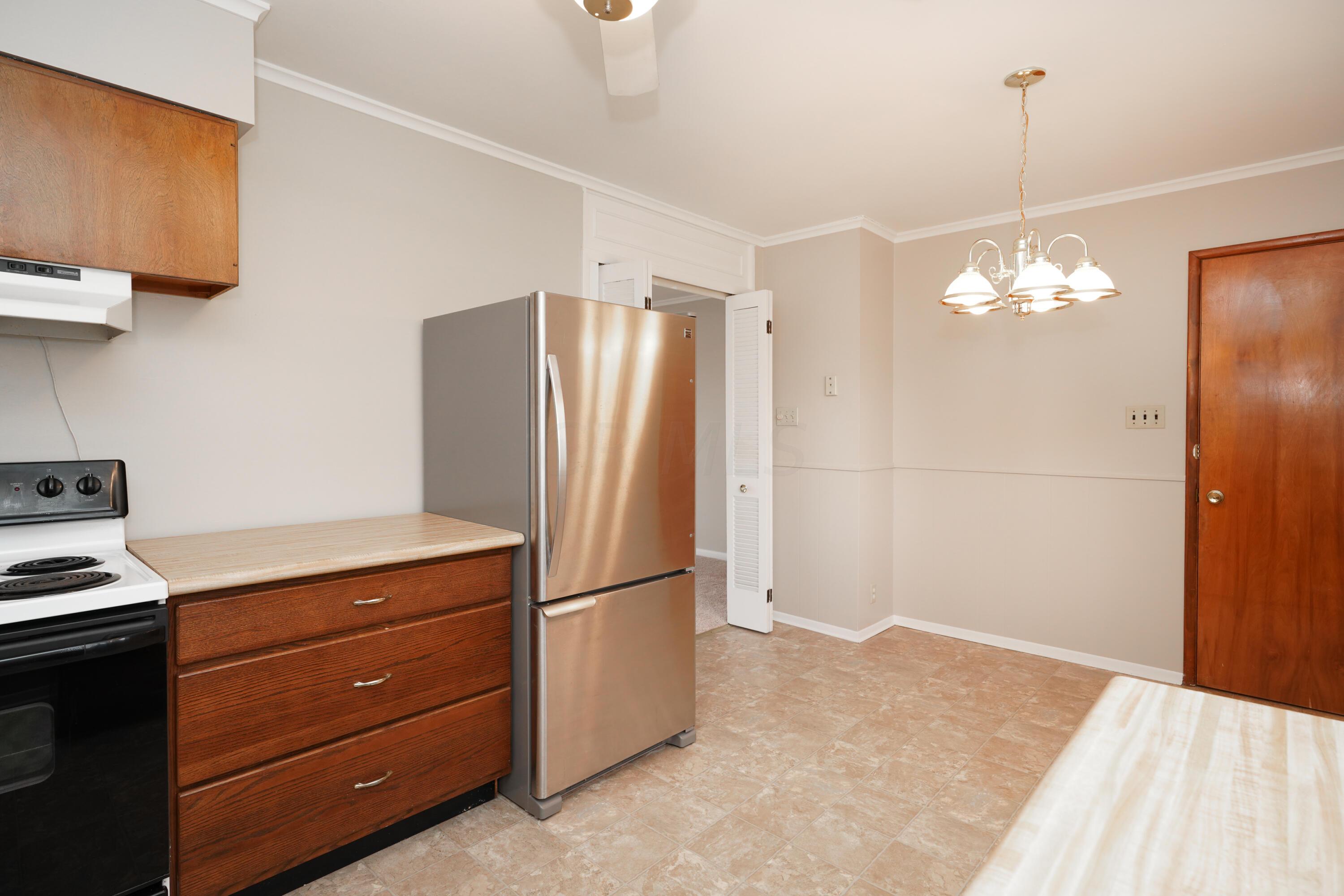 203 Troy Road Delaware, OH 43015 - Photo 16 of 37 Kitchen appliances remain with the home including the updated Stainless Steel fridge.
