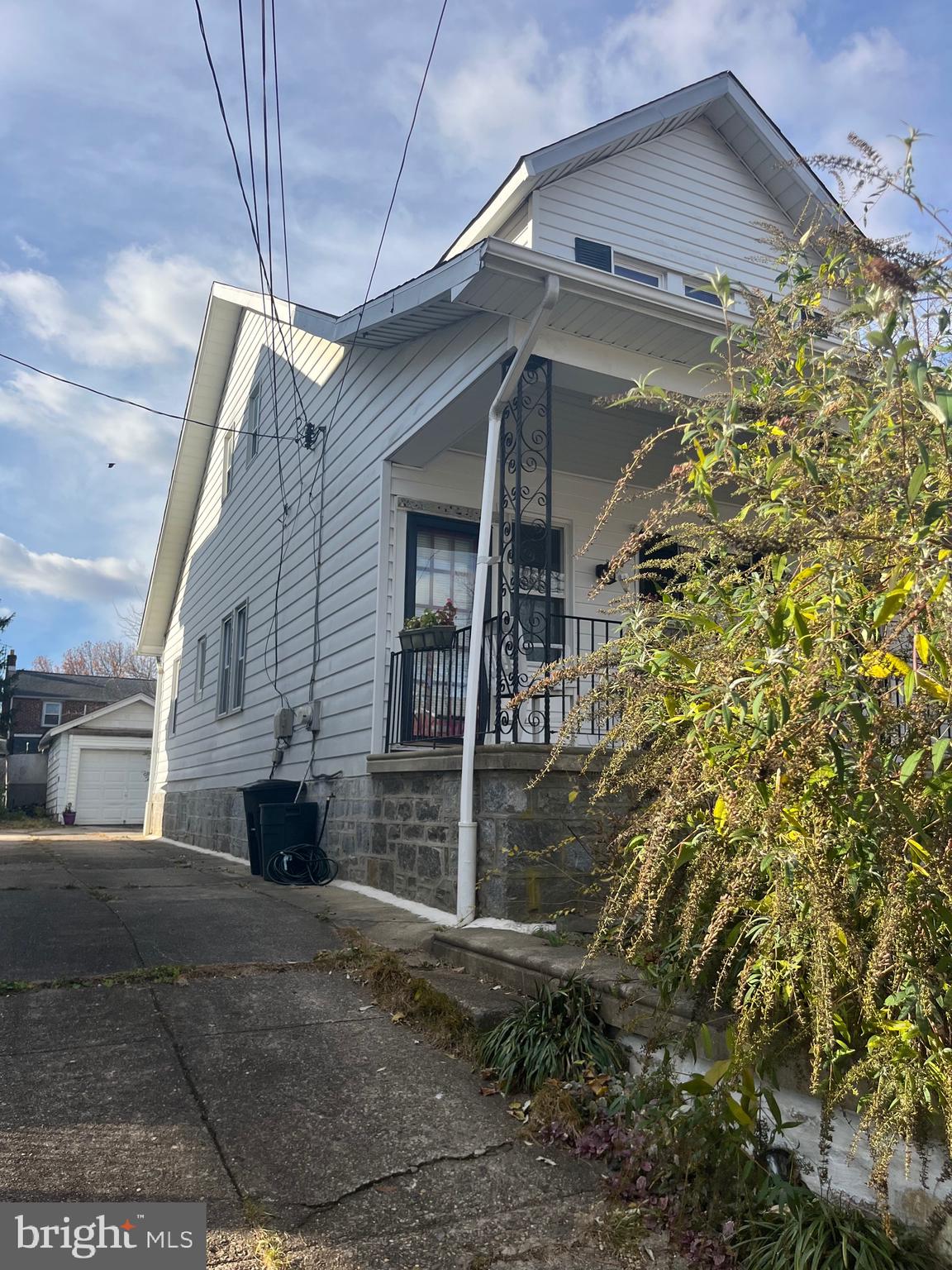 1808 Griffith Street Philadelphia, PA 19111 - Photo 2 of 5 a yellow house with tree in front of it