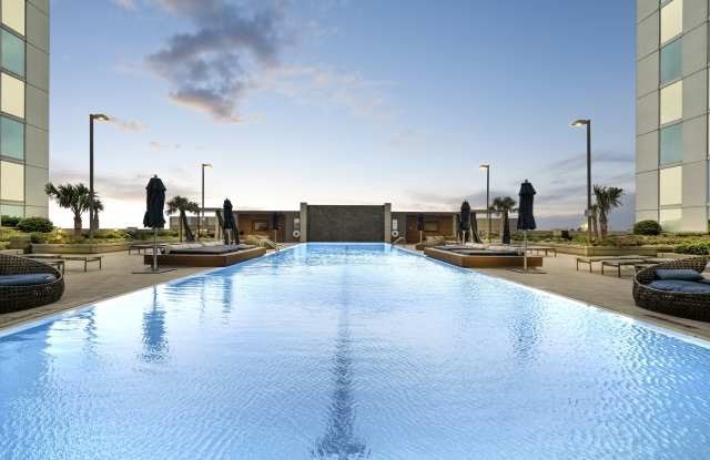 5925 Almeda Road, Unit 12308 Houston, TX 77004 - Photo 34 of 48 a view of a swimming pool with chairs