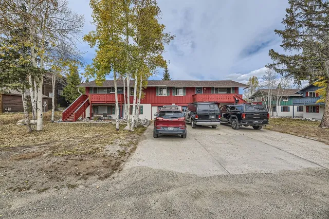 a view of street with parked cars