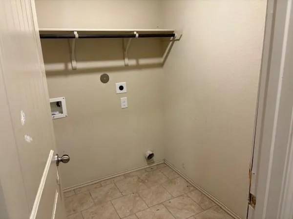 a view of an empty room with empty shelves