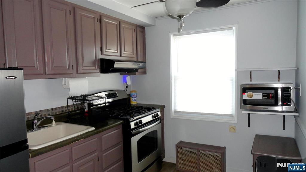 73 B Hastings Avenue, Unit B Rutherford, NJ 07070 - Photo 2 of 6 a kitchen with a sink stove and microwave