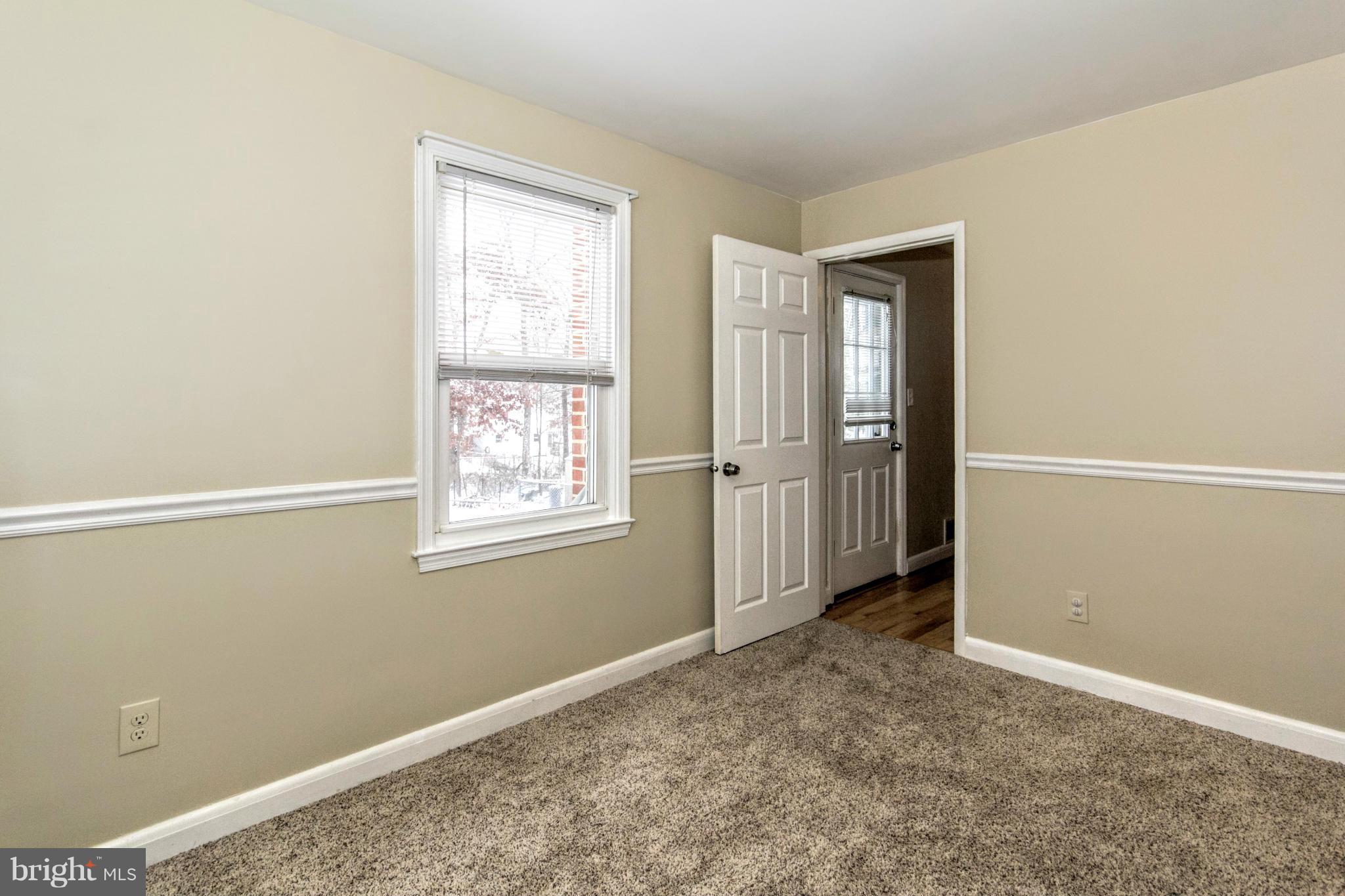 8109 Conduit Road Baltimore, MD 21234 - Photo 4 of 26 a view of an empty room with window