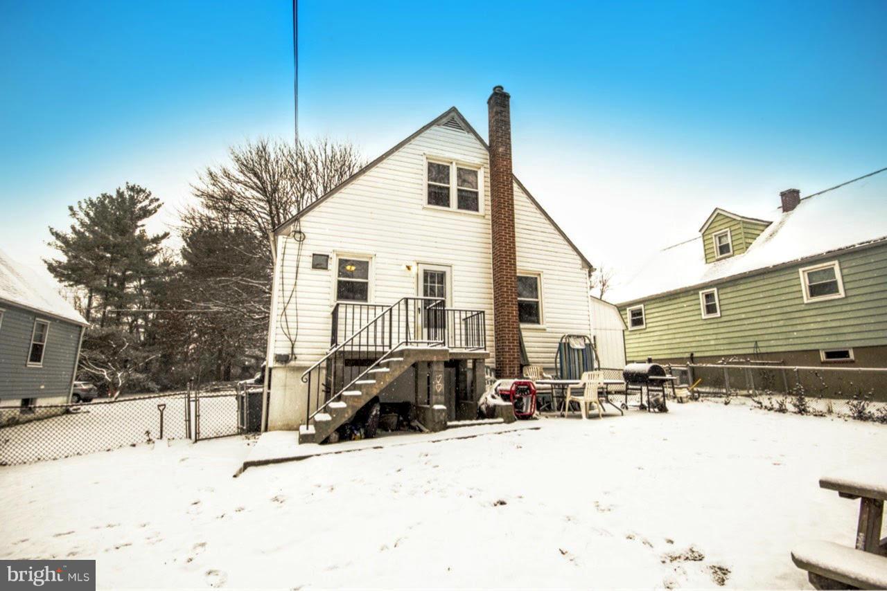 8109 Conduit Road Baltimore, MD 21234 - Photo 8 of 26 a view of a house with snow on the road