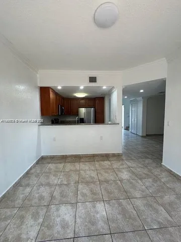 a view of an empty room with a fireplace