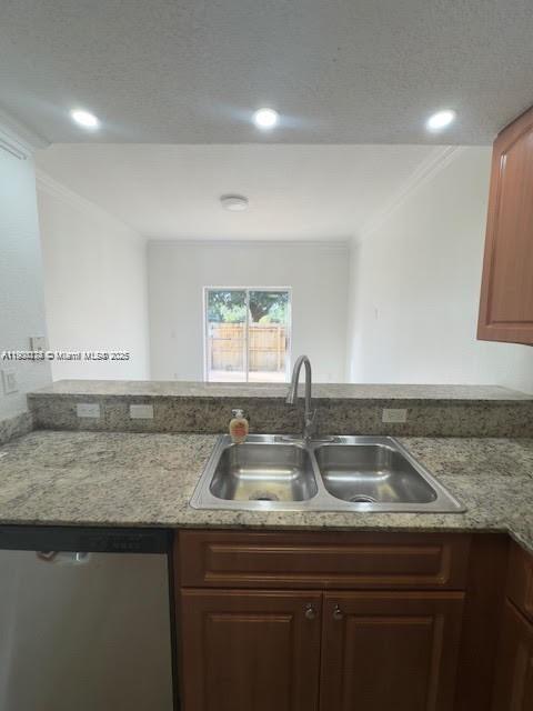 7250 Northwest 174th Terrace, Unit 102 Hialeah, FL 33015 - Photo 14 of 37 a kitchen with a sink a counter and cabinets