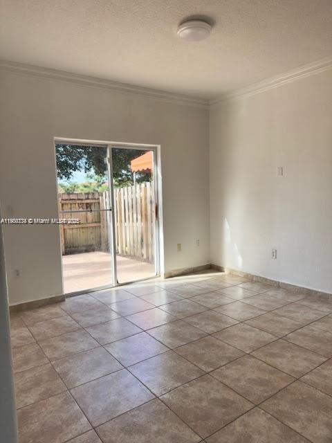 7250 Northwest 174th Terrace, Unit 102 Hialeah, FL 33015 - Photo 15 of 37 a view of an empty room with a fireplace