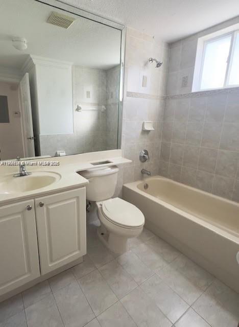 7250 Northwest 174th Terrace, Unit 102 Hialeah, FL 33015 - Photo 16 of 37 a bathroom with a toilet a sink a mirror and a bathtub