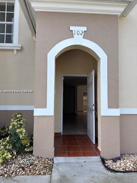 7250 Northwest 174th Terrace, Unit 102 Hialeah, FL 33015 - Photo 2 of 37 a view of a entryway door of the house