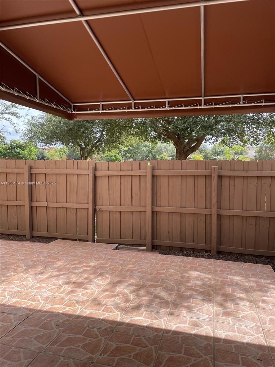 7250 Northwest 174th Terrace, Unit 102 Hialeah, FL 33015 - Photo 21 of 37 a view of a backyard