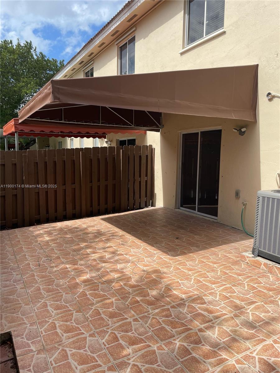 7250 Northwest 174th Terrace, Unit 102 Hialeah, FL 33015 - Photo 22 of 37 a view of a backyard of a house