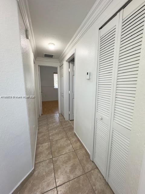 7250 Northwest 174th Terrace, Unit 102 Hialeah, FL 33015 - Photo 24 of 37 a view of a hallway