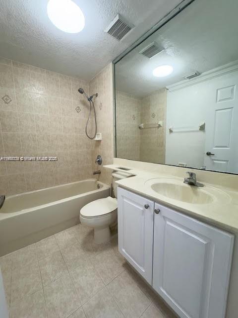 7250 Northwest 174th Terrace, Unit 102 Hialeah, FL 33015 - Photo 27 of 37 a bathroom with a granite countertop toilet a sink and a bathtub