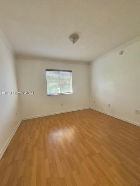 7250 Northwest 174th Terrace, Unit 102 Hialeah, FL 33015 - Photo 29 of 37 an empty room with a empty space and window