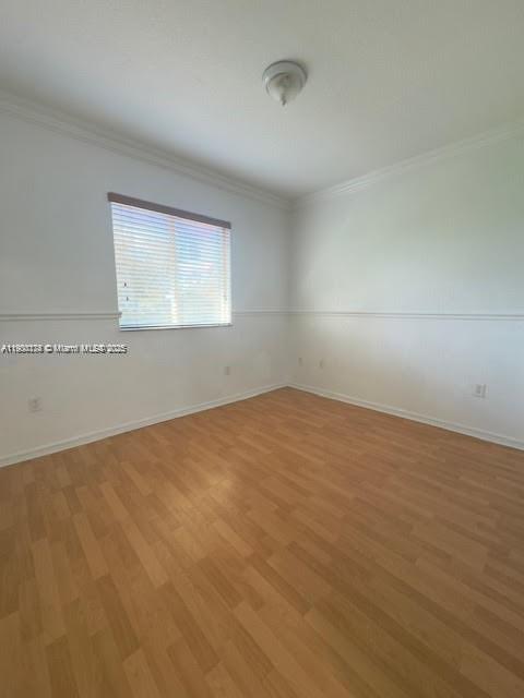 7250 Northwest 174th Terrace, Unit 102 Hialeah, FL 33015 - Photo 33 of 37 an empty room with a empty space and window