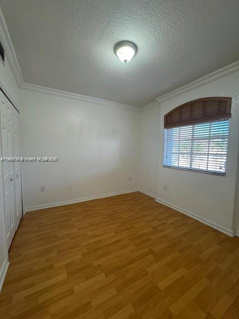 7250 Northwest 174th Terrace, Unit 102 Hialeah, FL 33015 - Photo 34 of 37 an empty room with a empty space and windows