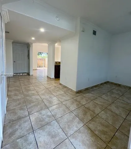 a view of an empty room and window