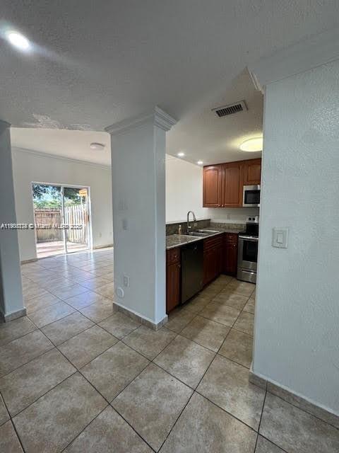 7250 Northwest 174th Terrace, Unit 102 Hialeah, FL 33015 - Photo 5 of 37 a large kitchen with granite countertop a large counter top and appliances