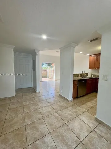 a view of a kitchen with a sink and a microwave