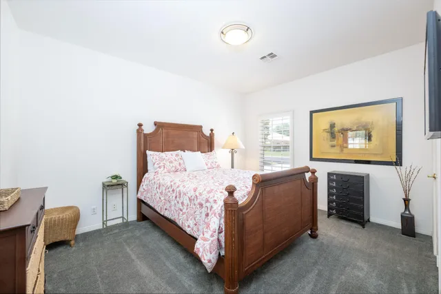 a bed room with a bed and furniture