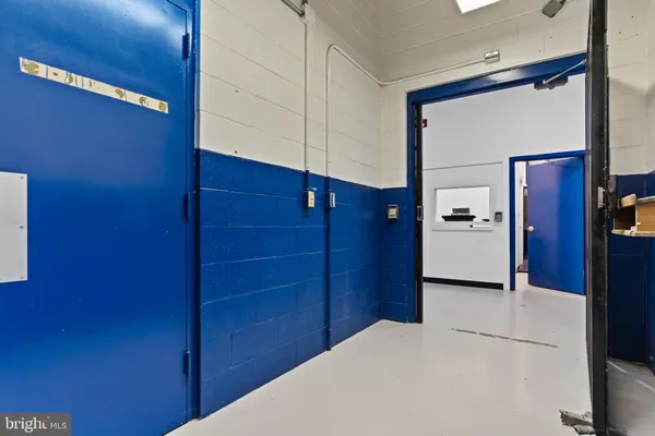 a view of a hallway with windows