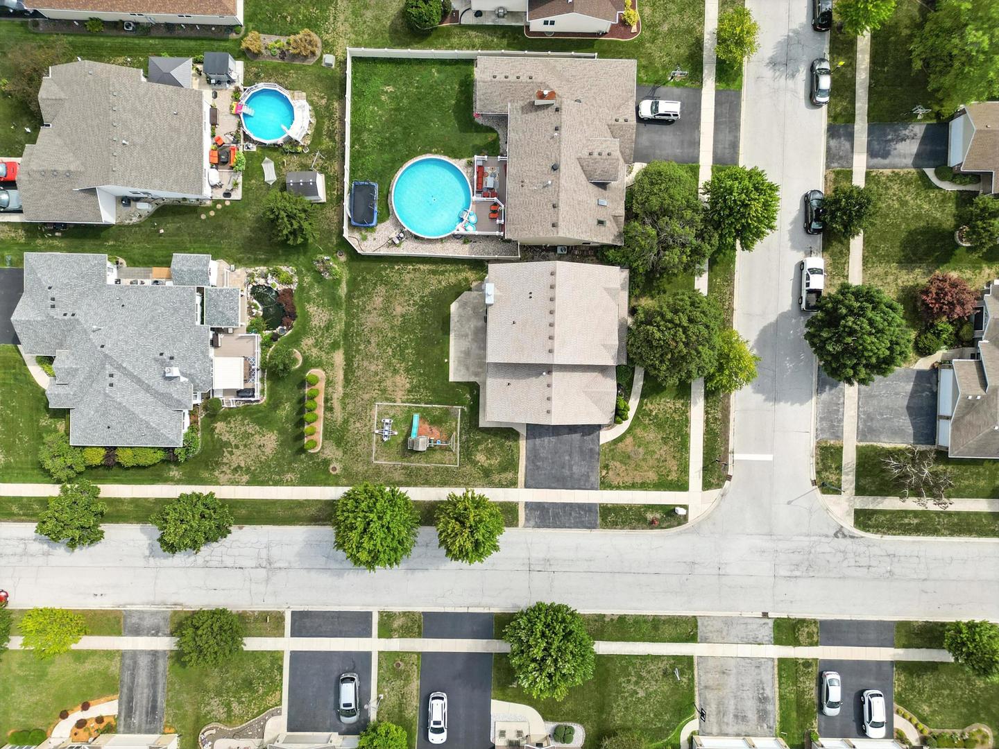 1665 Fox Hound Trail Beecher, IL 60401 - Photo 34 of 34 an aerial view of a house with a swimming pool