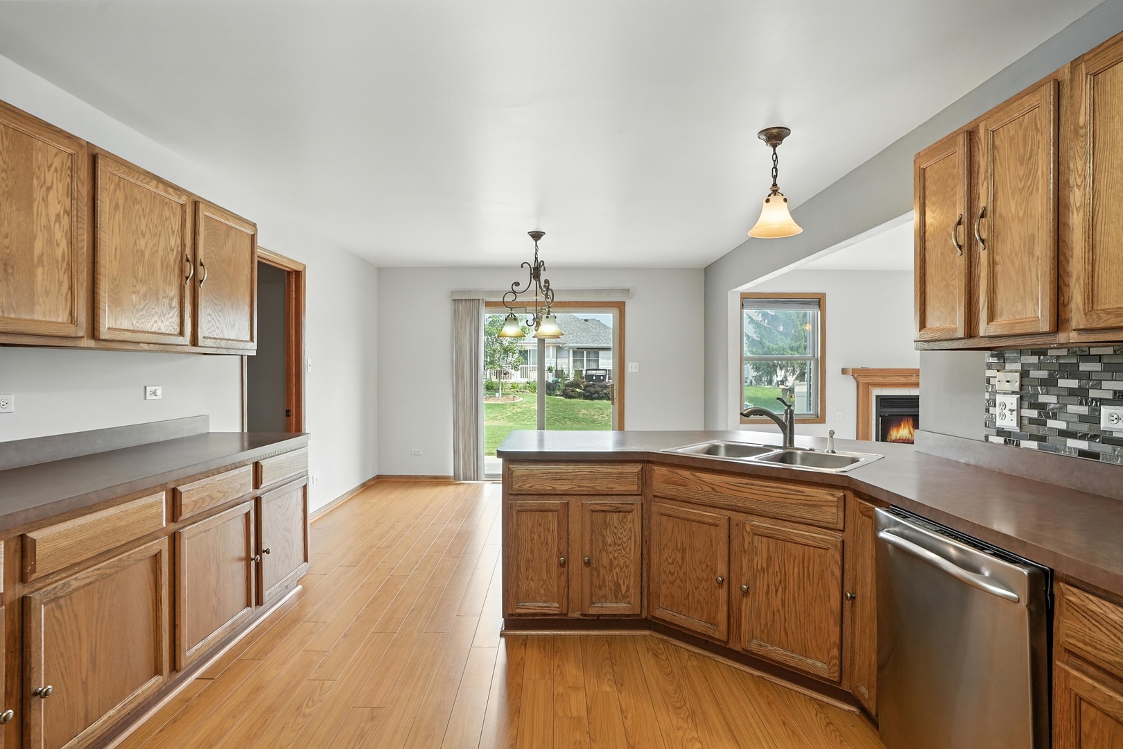 1665 Fox Hound Trail Beecher, IL 60401 - Photo 4 of 34 a kitchen with a sink a window and cabinets