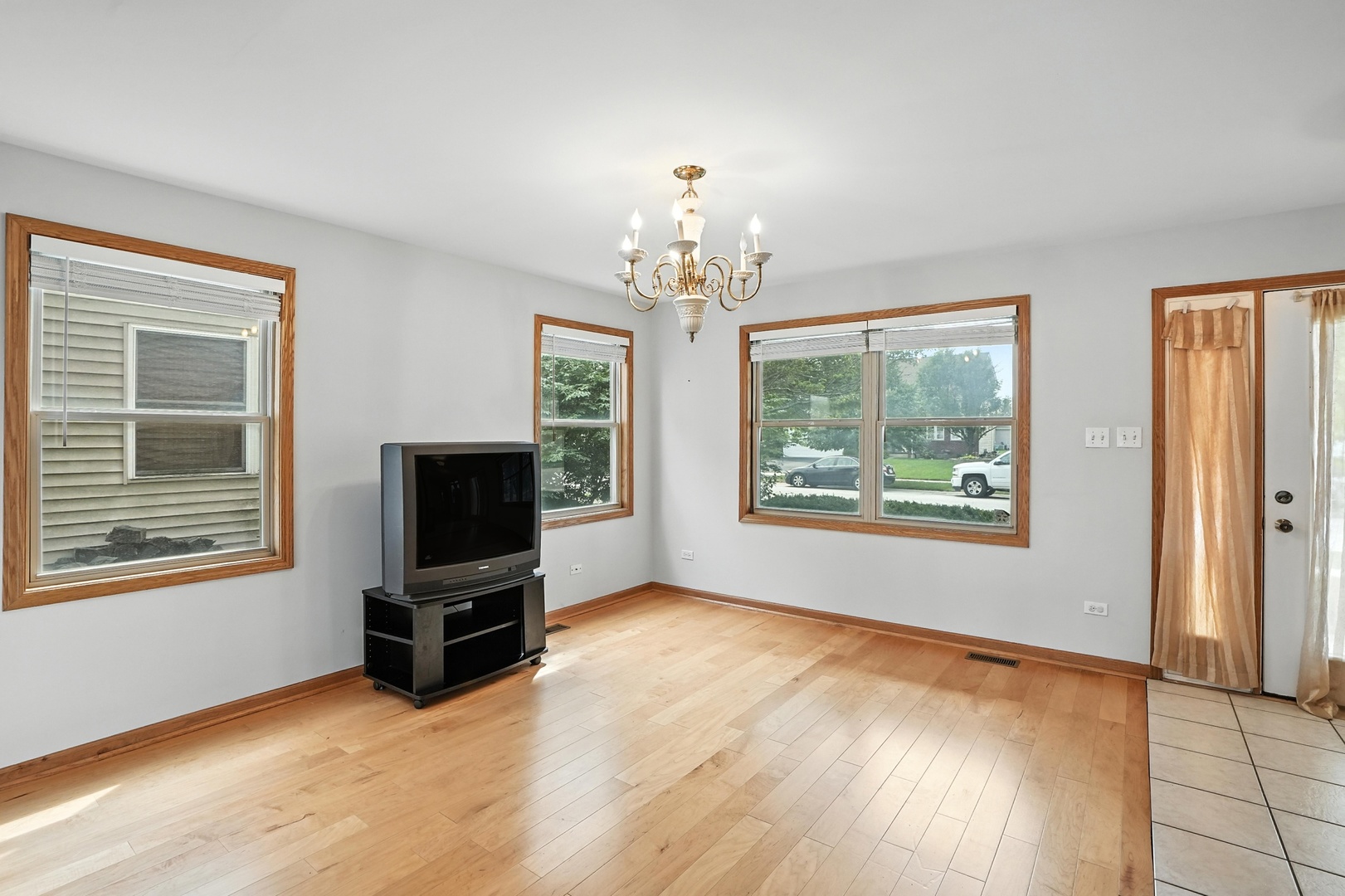 1665 Fox Hound Trail Beecher, IL 60401 - Photo 9 of 34 a view of an empty room with a window and wooden floor
