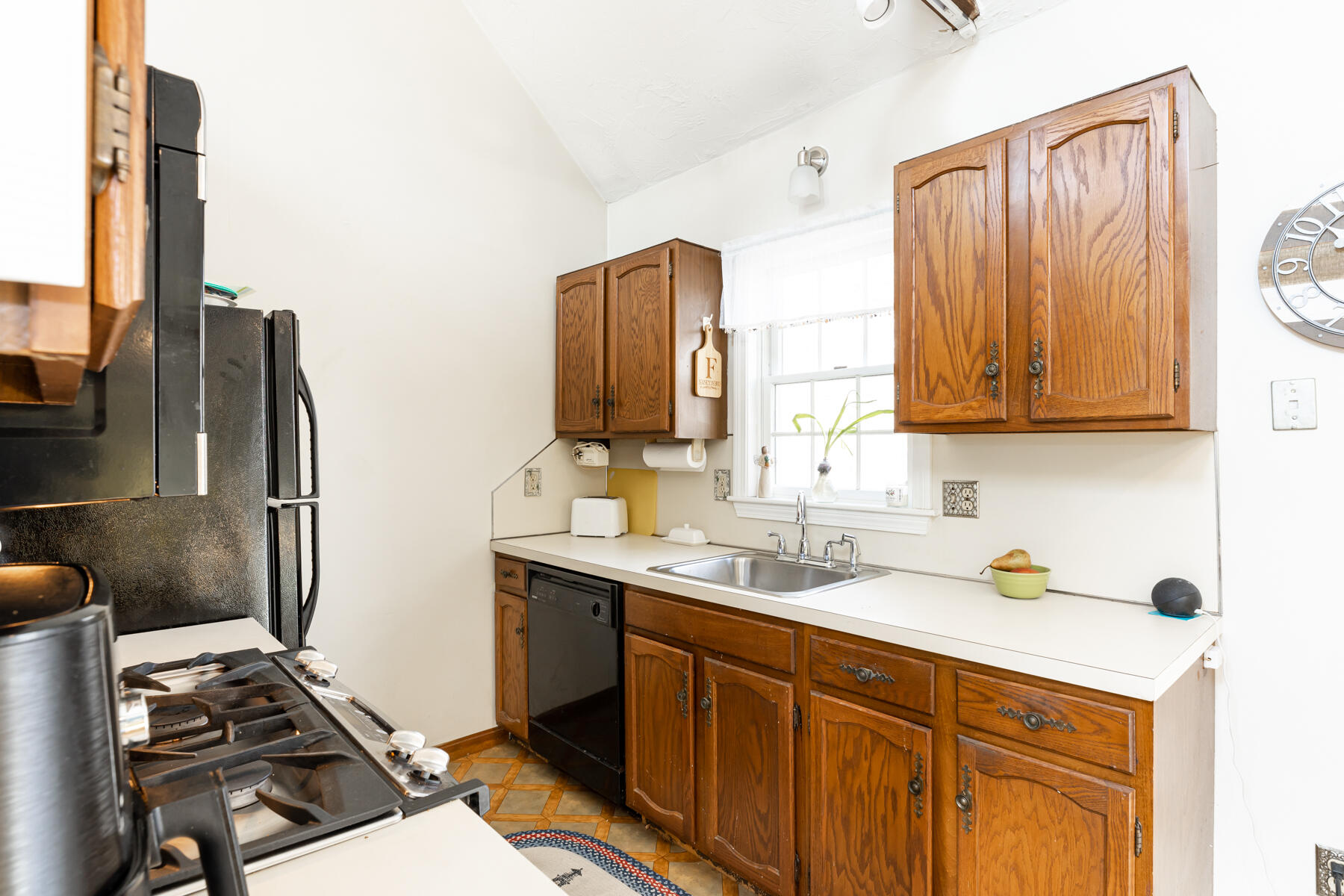 61 Edgewater Road Mashpee, MA 02649 - Photo 15 of 45 a kitchen with a sink appliances and cabinets