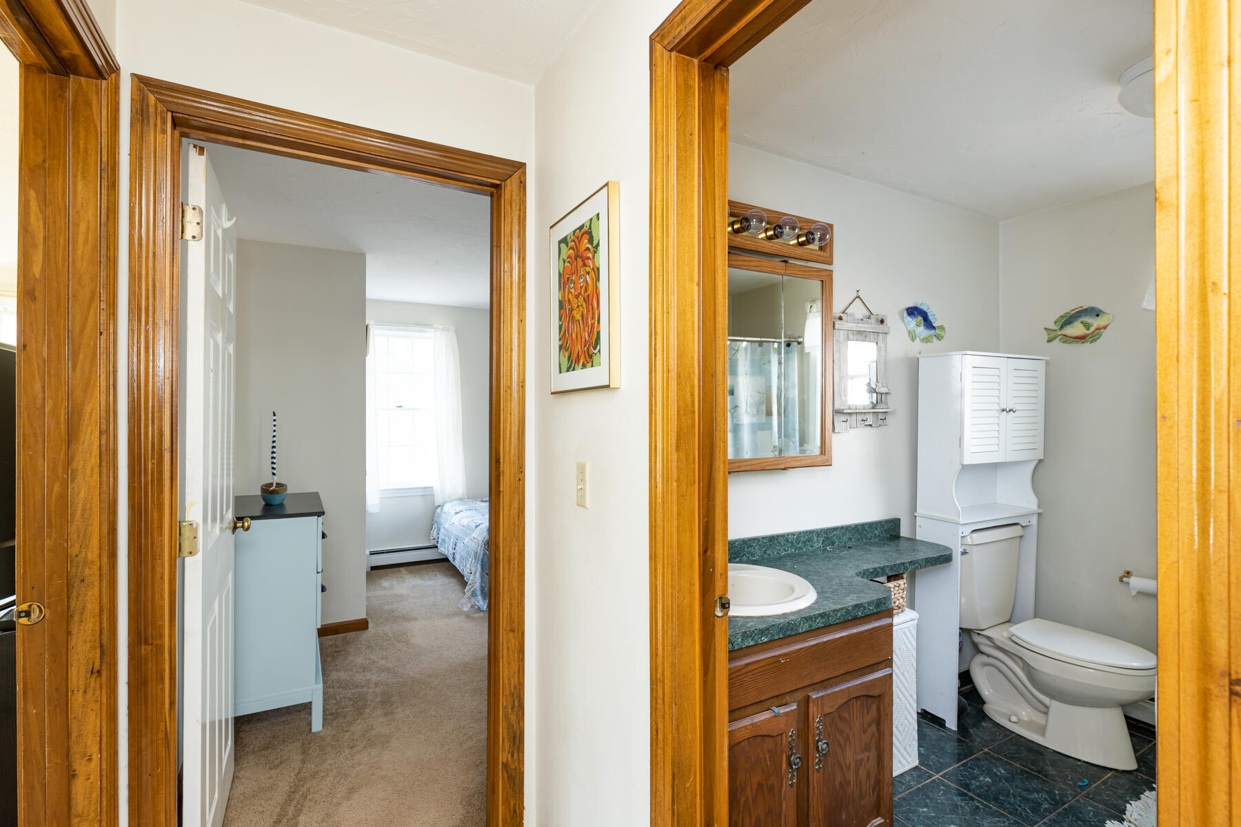 61 Edgewater Road Mashpee, MA 02649 - Photo 17 of 45 a bathroom with a granite countertop toilet sink and a mirror