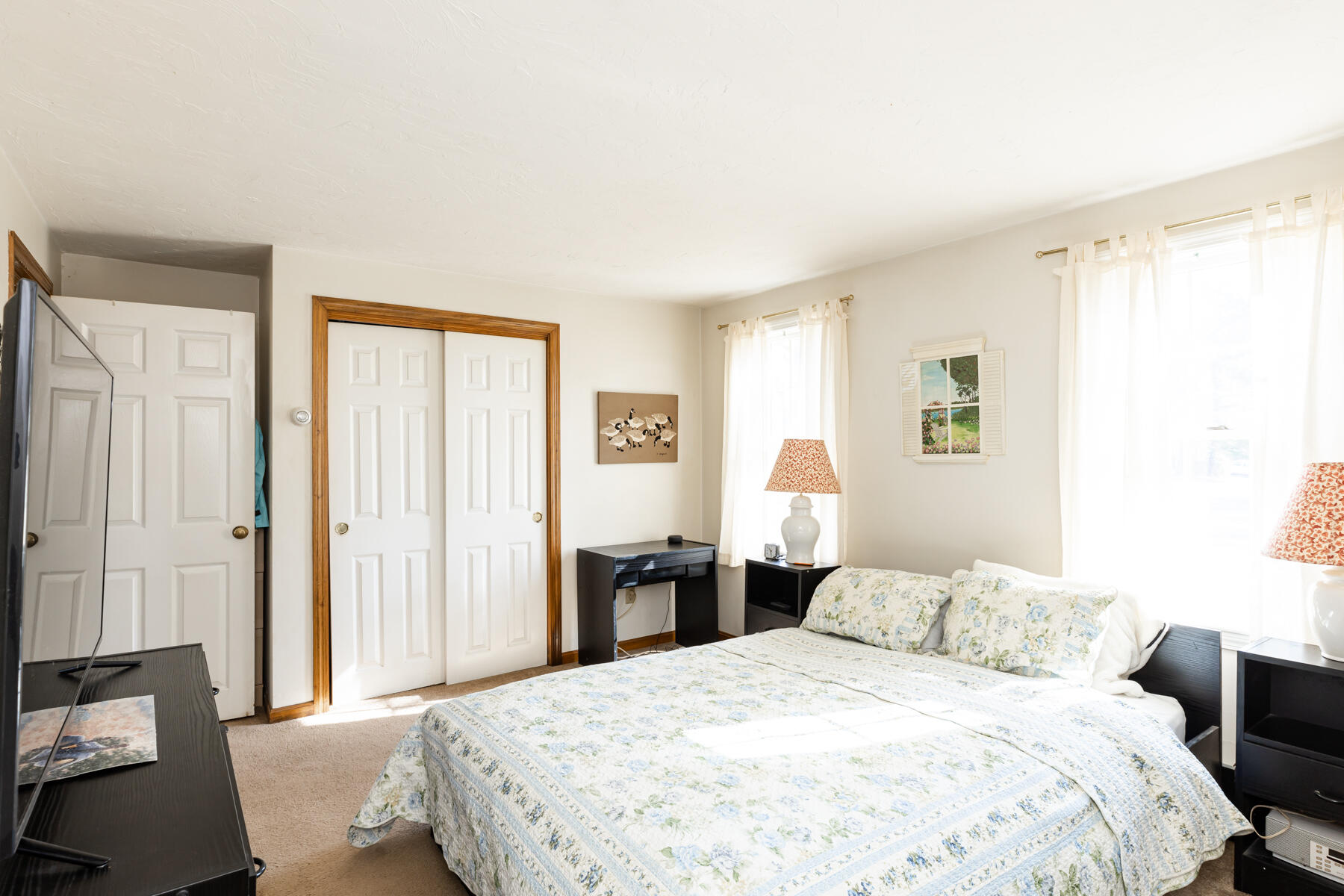 61 Edgewater Road Mashpee, MA 02649 - Photo 19 of 45 a bedroom with a bed and a window