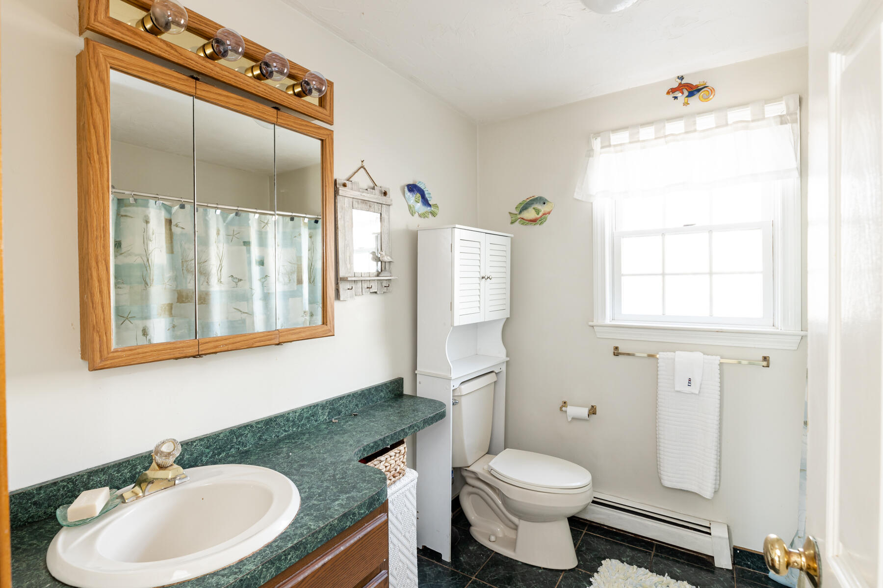61 Edgewater Road Mashpee, MA 02649 - Photo 21 of 45 a bathroom with a sink toilet and shower