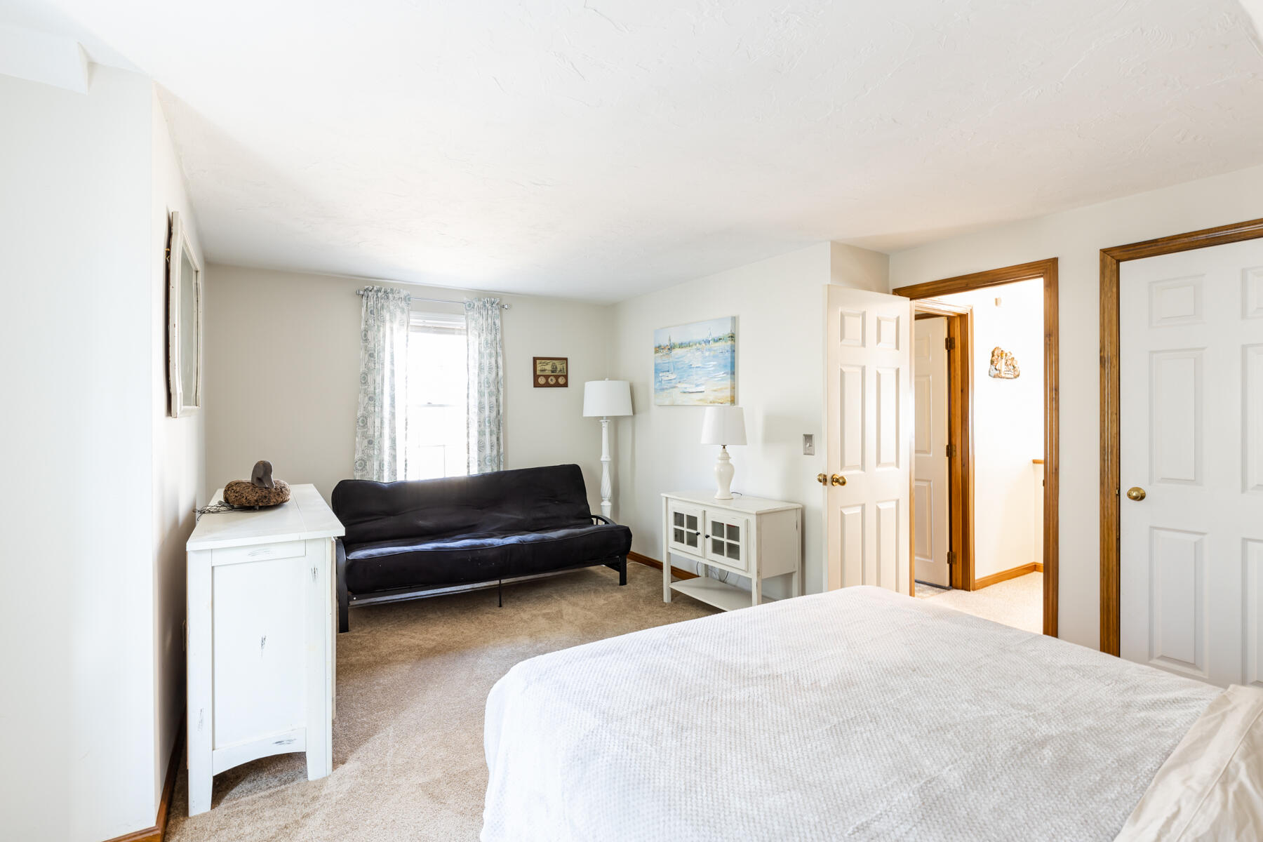 61 Edgewater Road Mashpee, MA 02649 - Photo 25 of 45 a bedroom with a bed and a couch