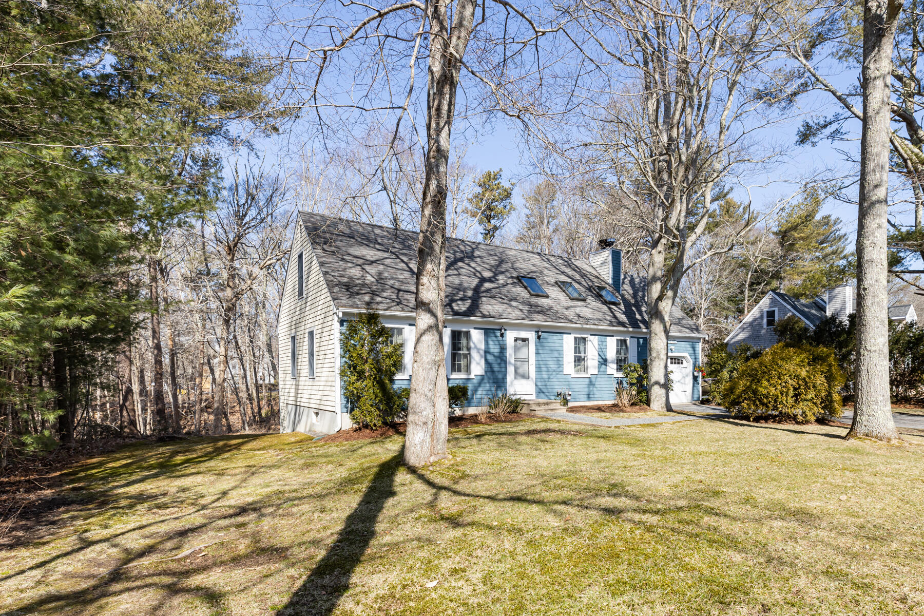 61 Edgewater Road Mashpee, MA 02649 - Photo 6 of 45 a front view of a building with large trees