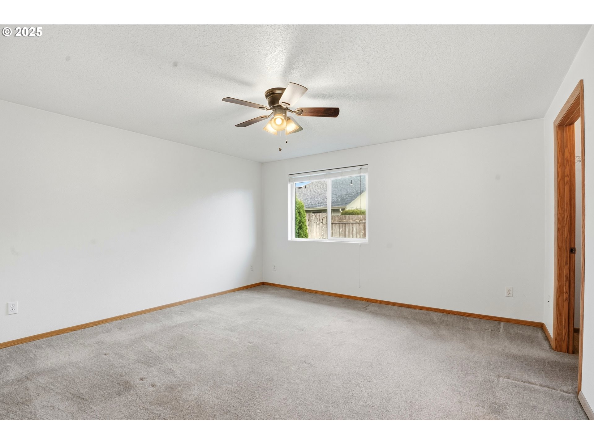 513 Southeast Clark Avenue Battle Ground, WA 98604 - Photo 16 of 30 an empty room with a window and a ceiling fan