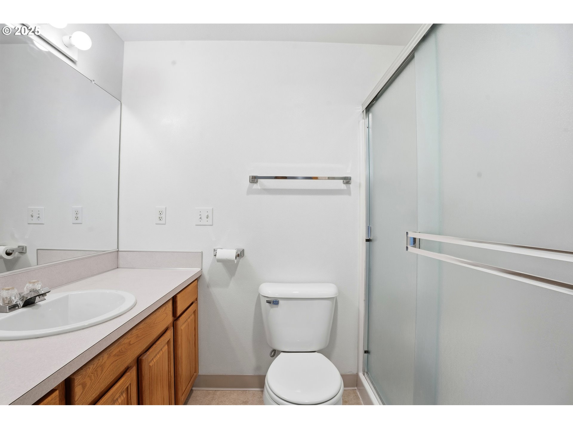 513 Southeast Clark Avenue Battle Ground, WA 98604 - Photo 18 of 30 a bathroom with a sink a toilet and a mirror
