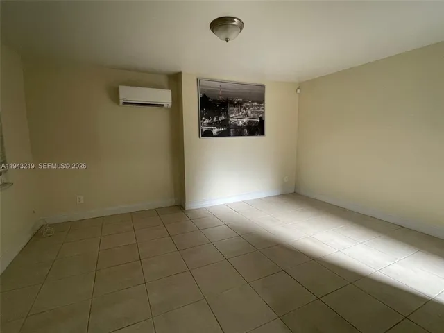 an empty room with a empty space and window