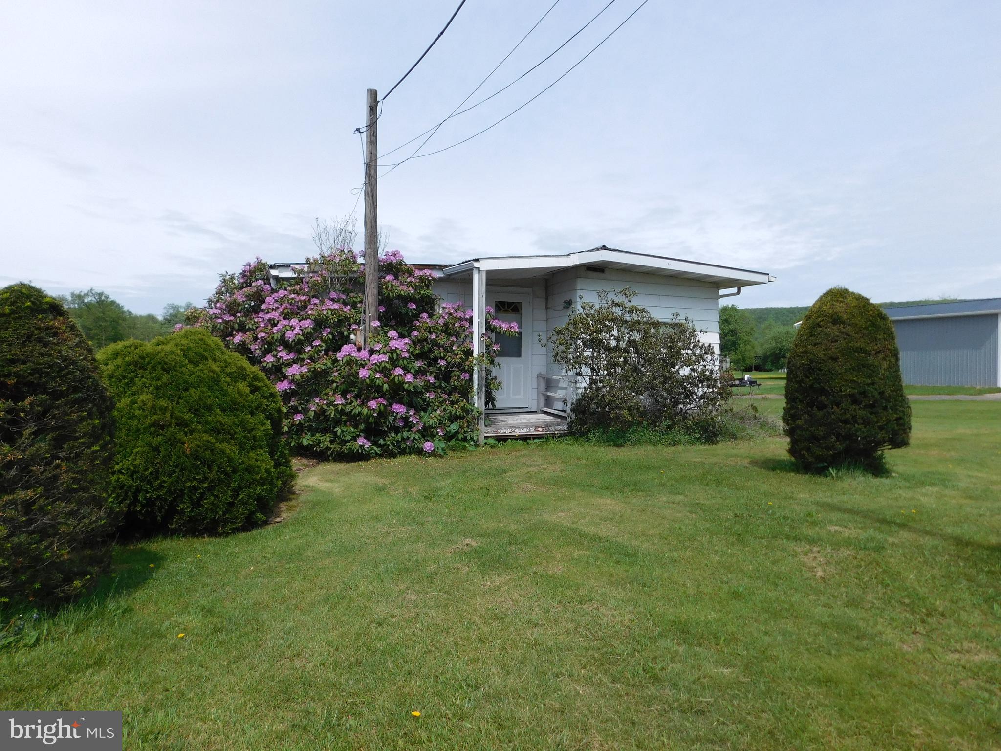 3551 Quakake Road Weatherly, PA 18255 - Photo 6 of 15 a front view of a house with garden