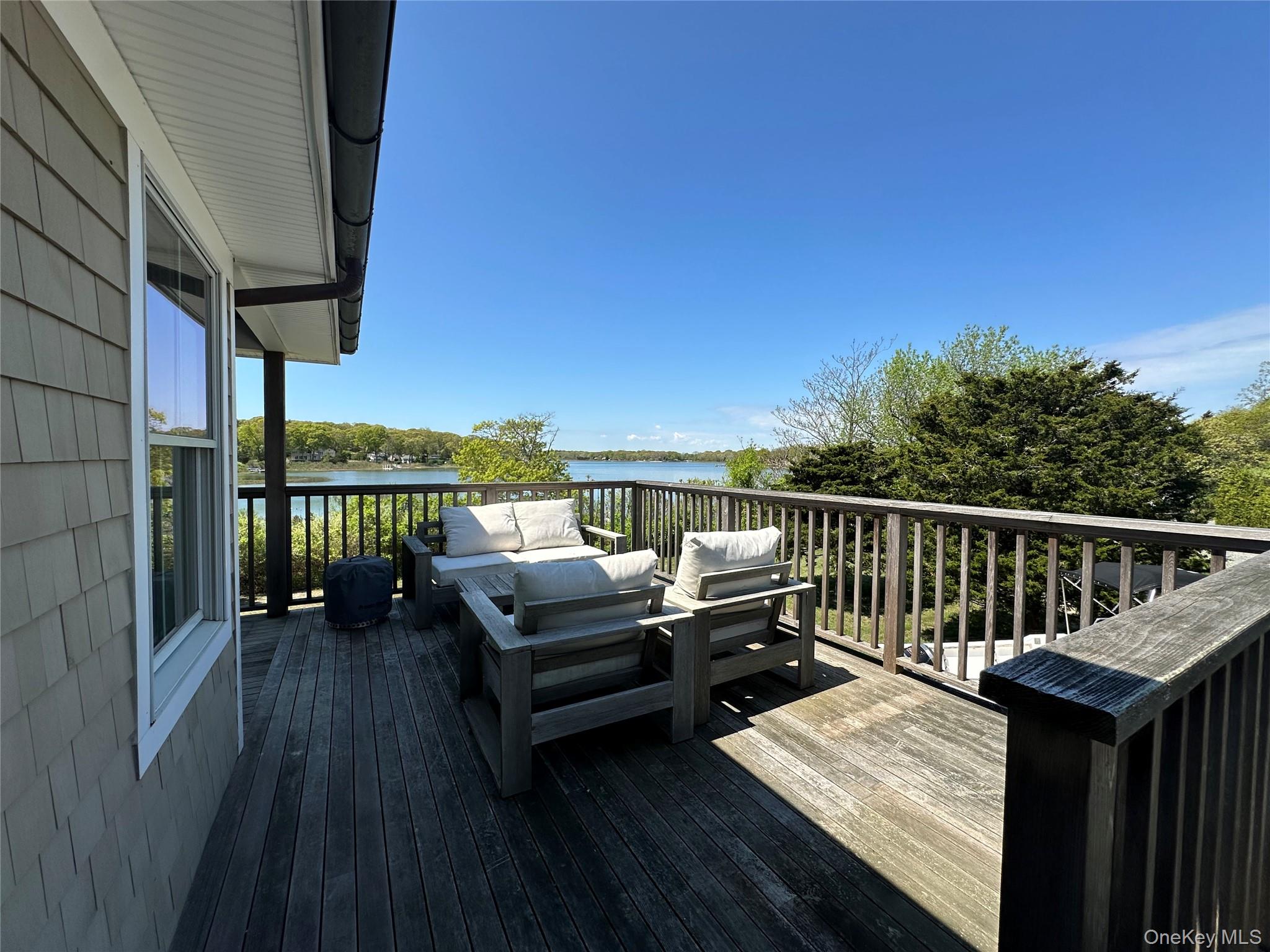 1854 North Bayview Road Southold, NY 11971 - Photo 6 of 20 Deck featuring outdoor lounge area and a water view