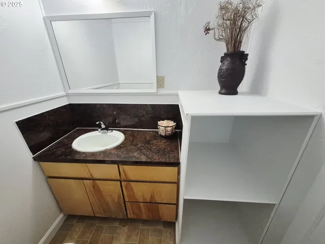 a bathroom with a sink and a mirror
