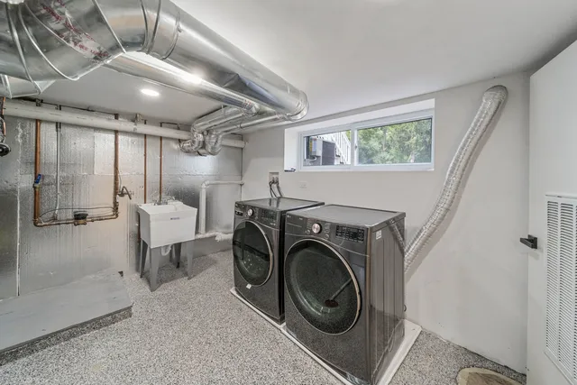a view of a storage & utility room with washer and dryer