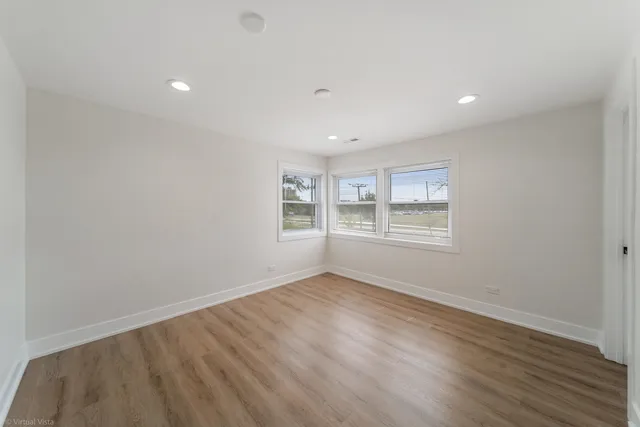 a front view of a house with swimming pool and porch